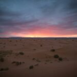 view of sand dunes during golden hour